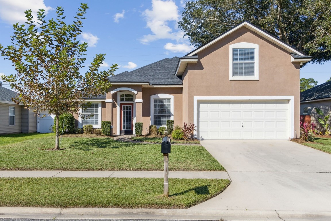 a front view of a house with a yard