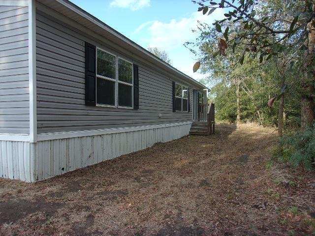 a view of backyard with green space