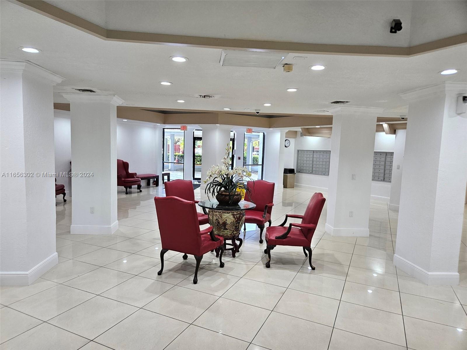 a living room with furniture a dining table and chairs