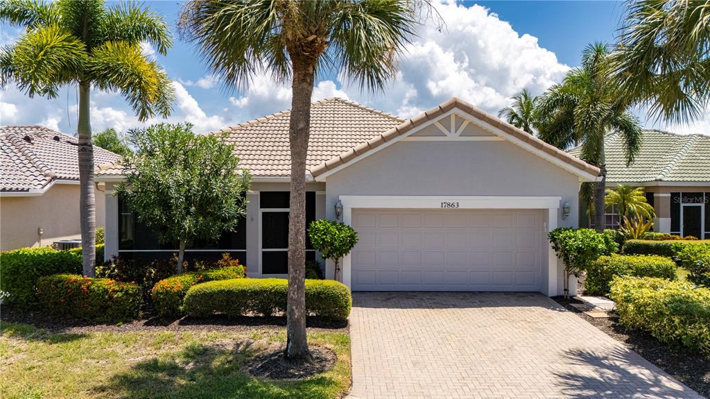 a house with palm tree in front of it