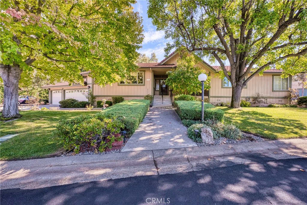 a front view of a house with garden