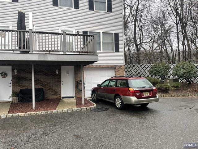 a car parked in front of a house