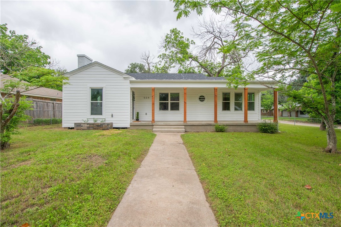 front view of a house with a yard