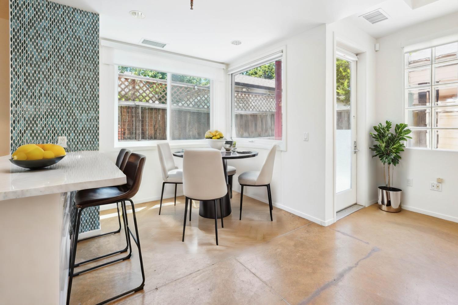 a view of a dining room with furniture and window