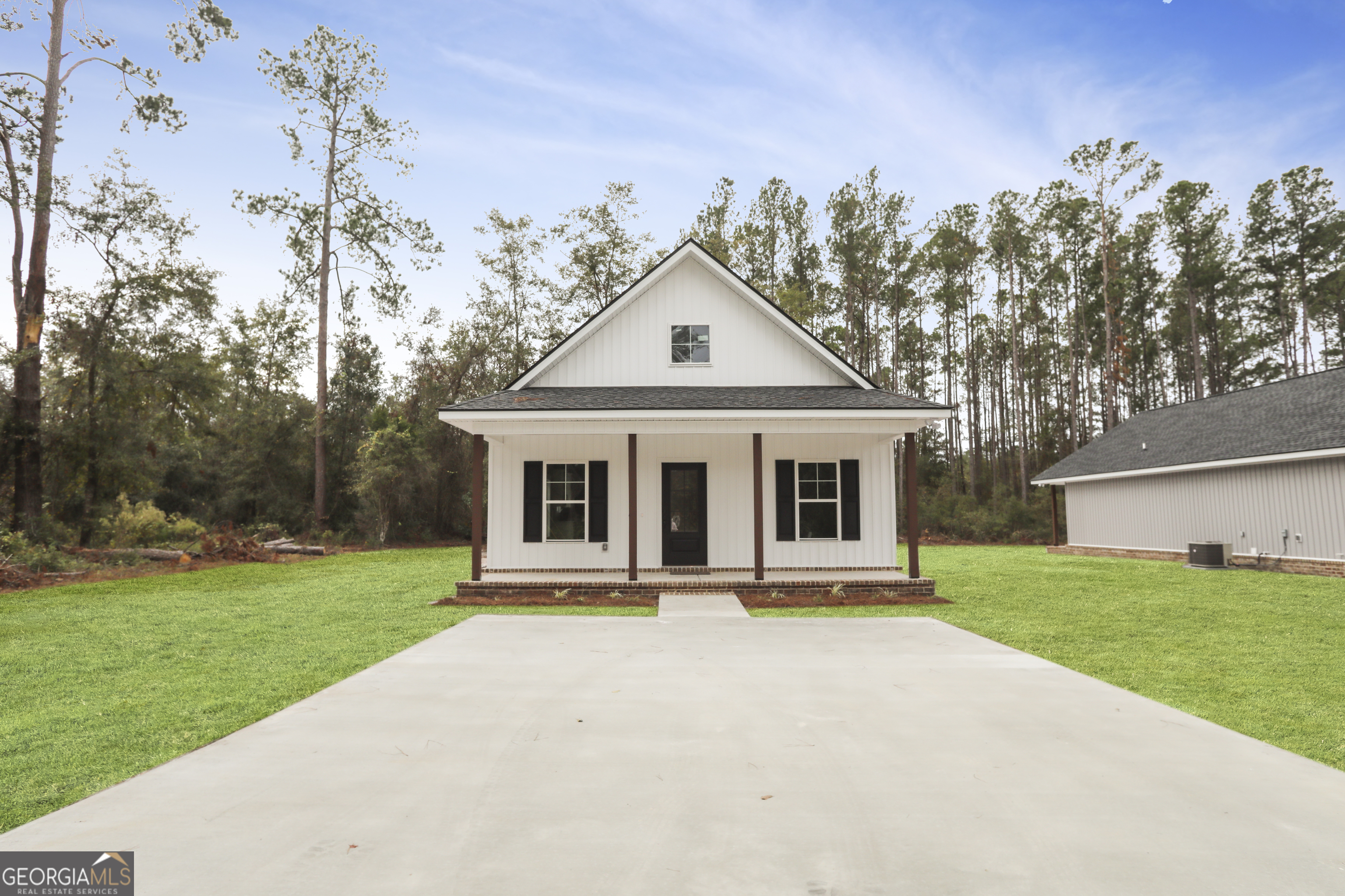 a front view of a house with yard