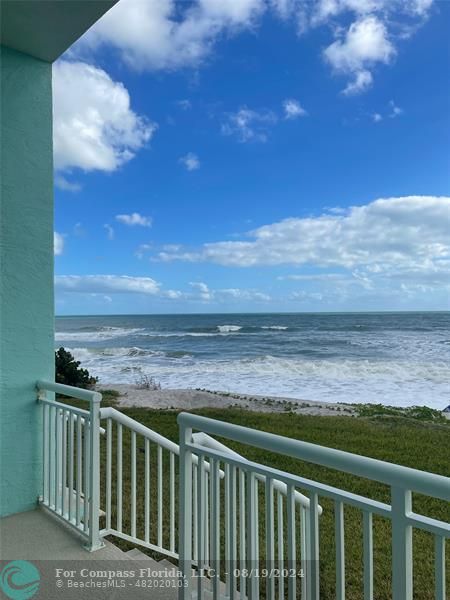 a view of a balcony with an outdoor space