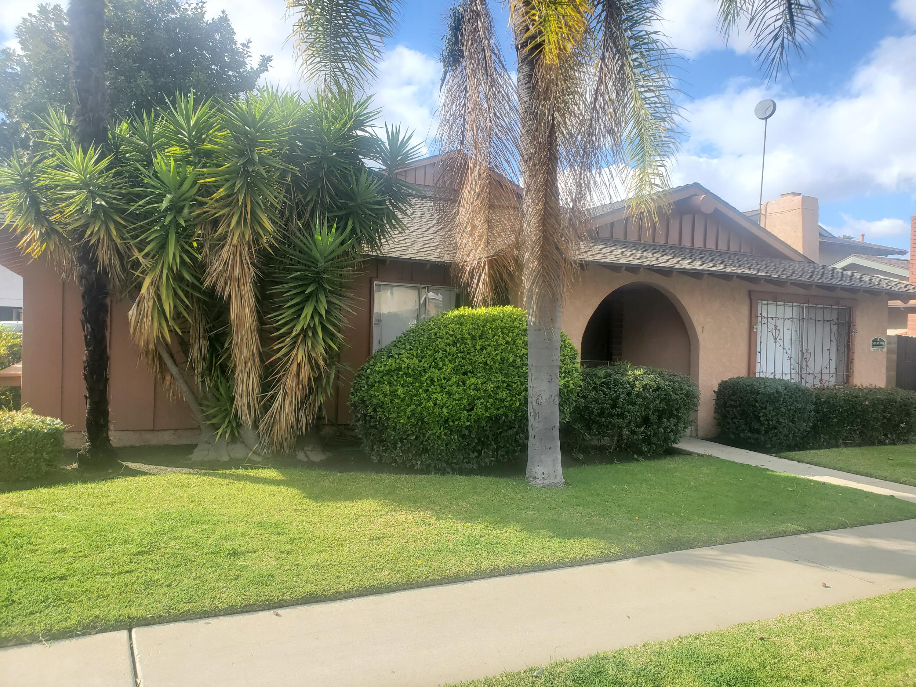 a view of a yard in front of a house