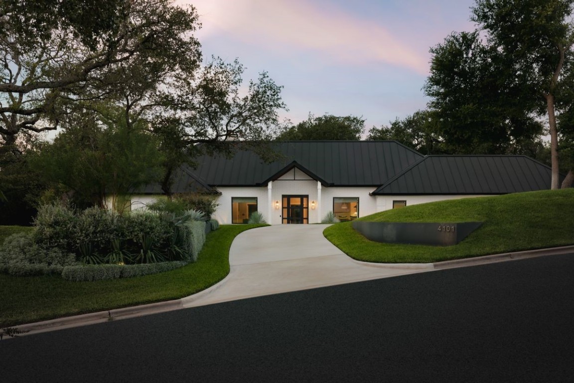 a view of house with yard and green space