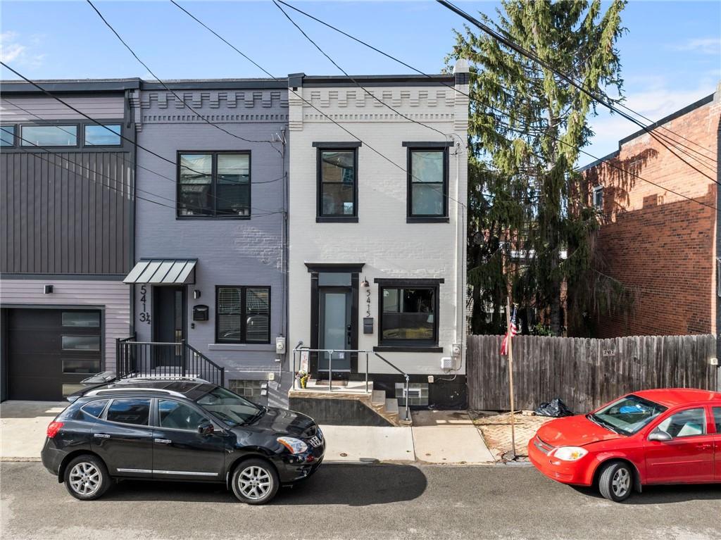 a car parked in front of a house