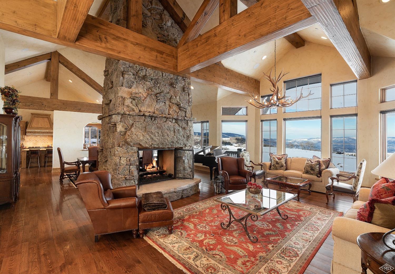 a living room with fireplace furniture or couch and a large window