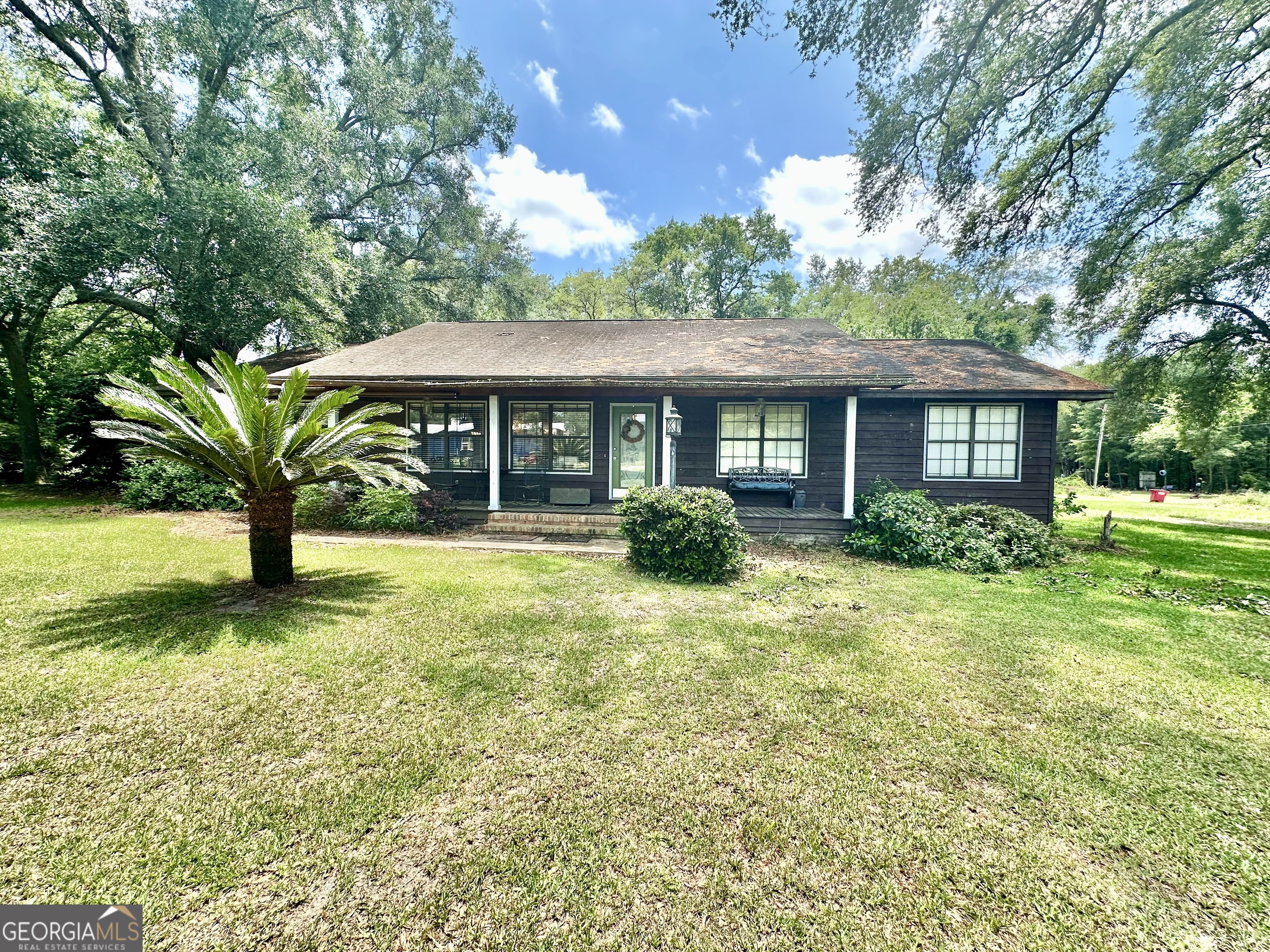 a front view of a house with a yard