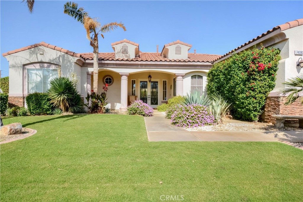 a front view of a house with garden