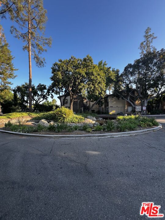 a view of a street with a park