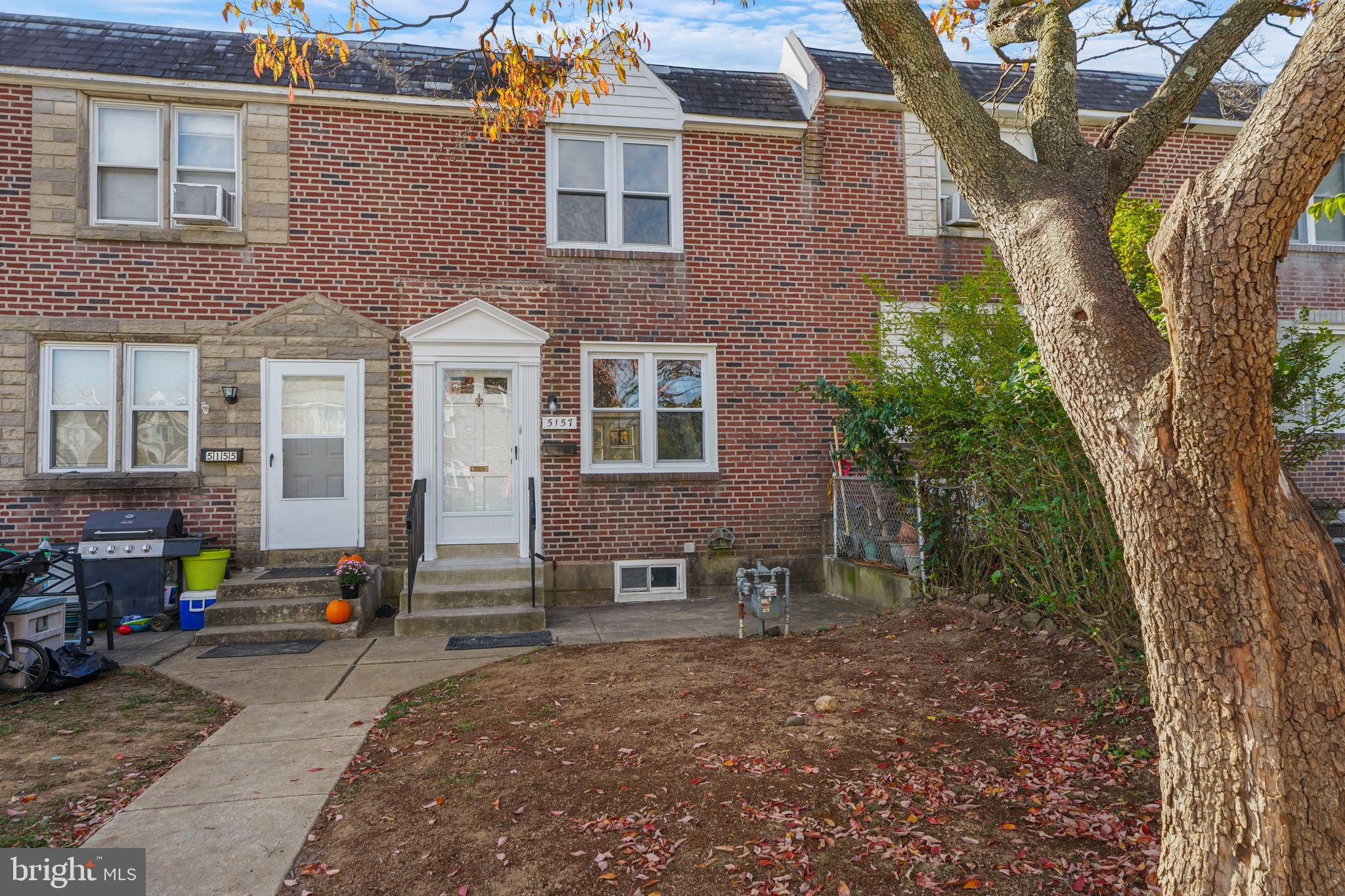 a view of multiple houses with outdoor space