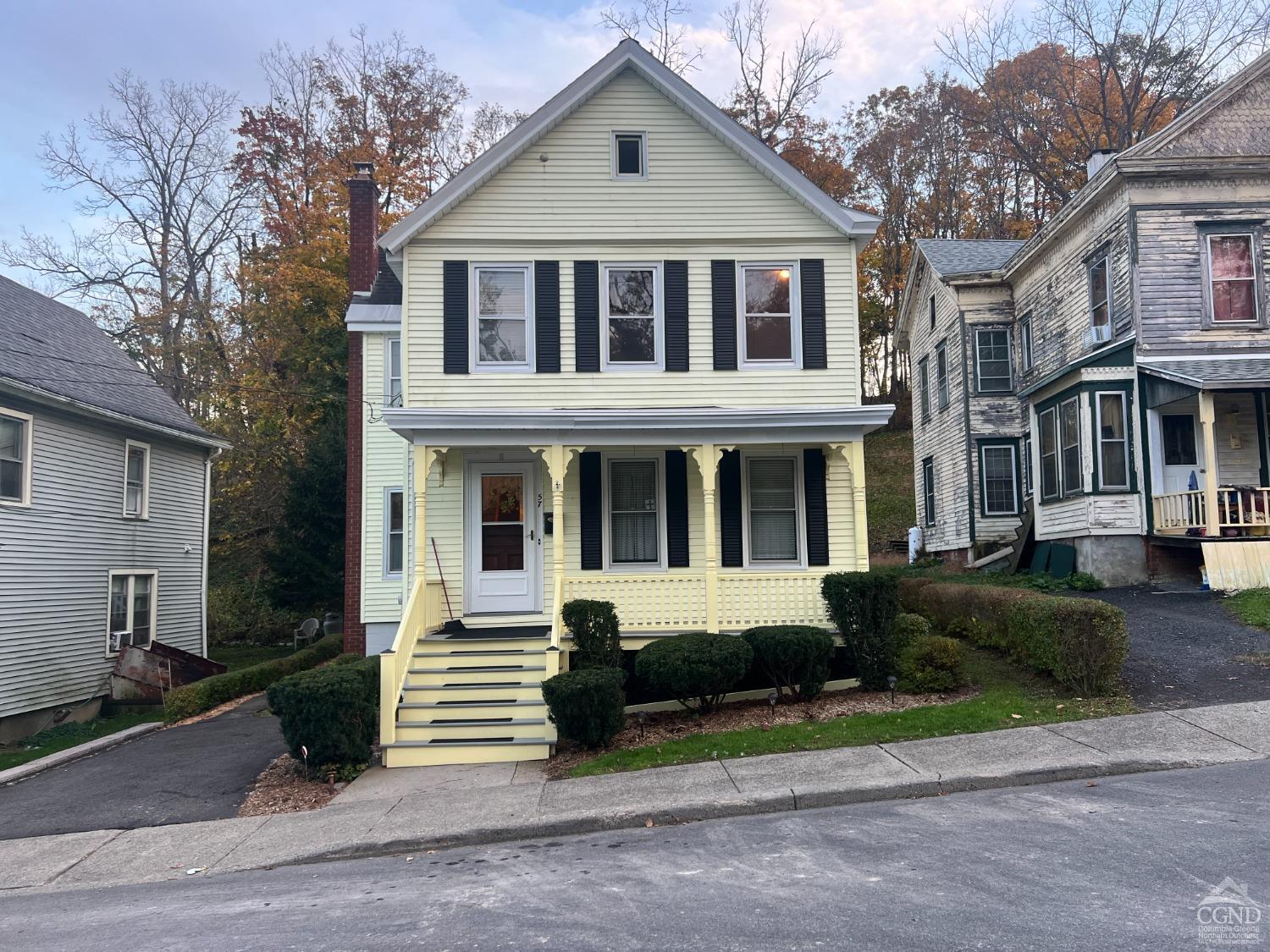 a front view of a house with a yard