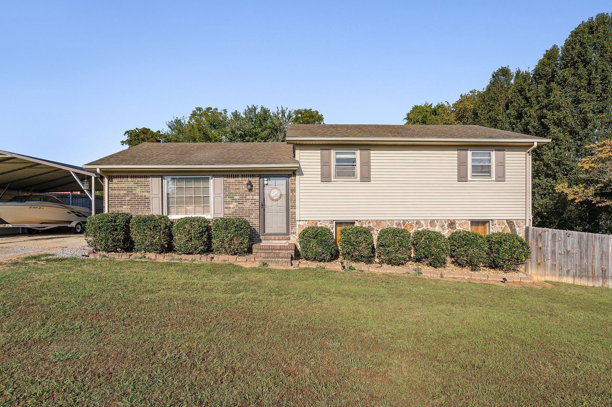 a front view of a house with a yard