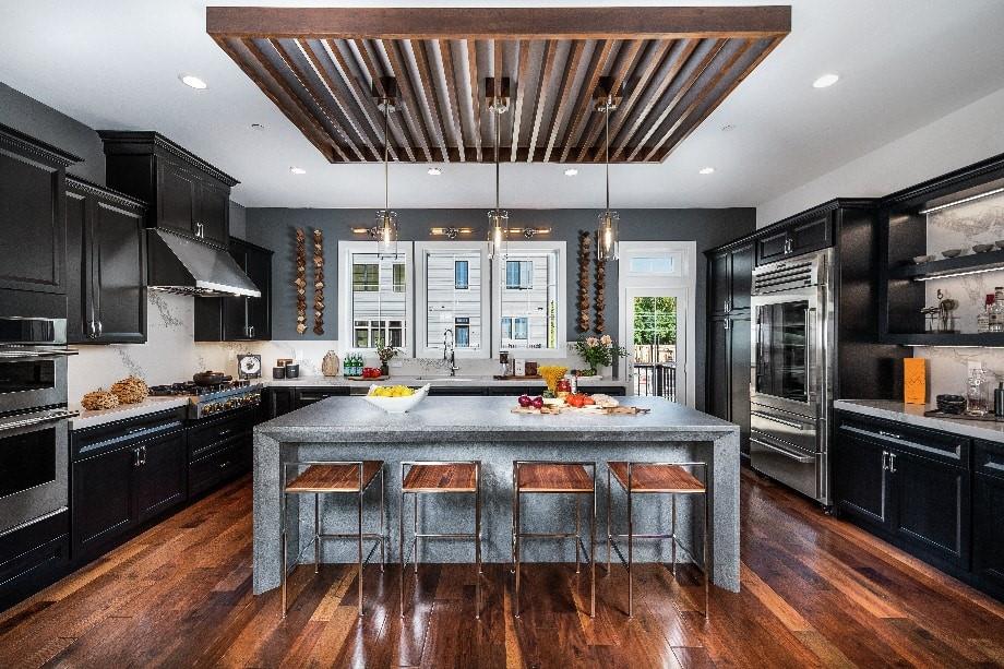 a kitchen with stainless steel appliances granite countertop a stove and a refrigerator