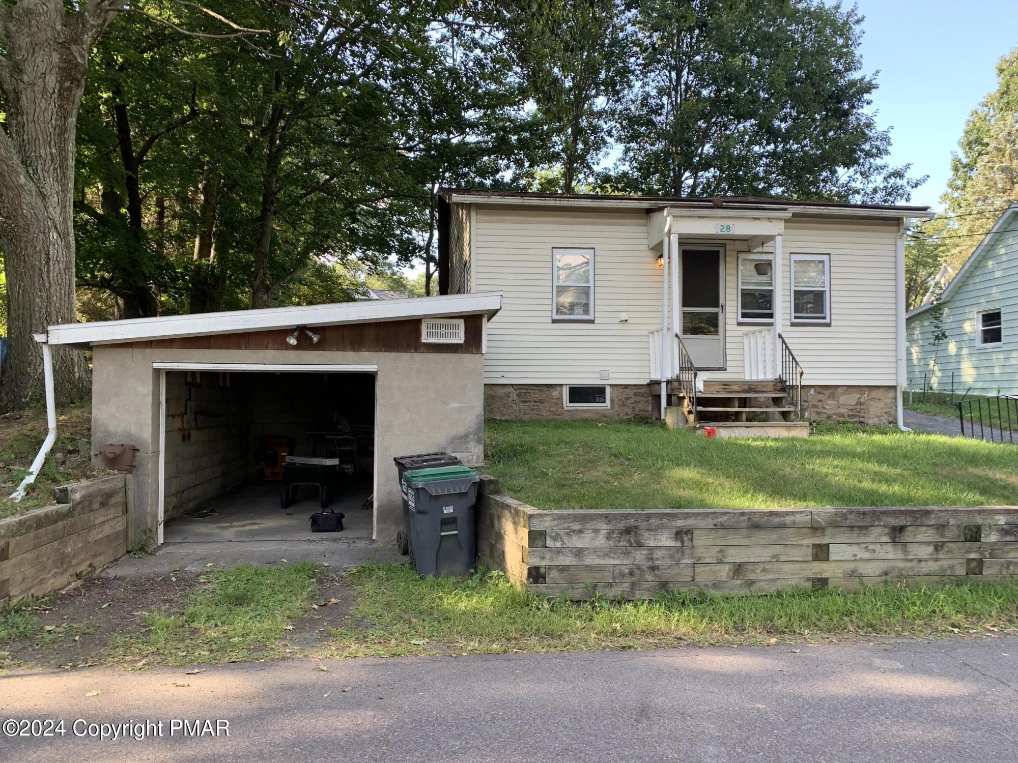 front view of a house with a yard