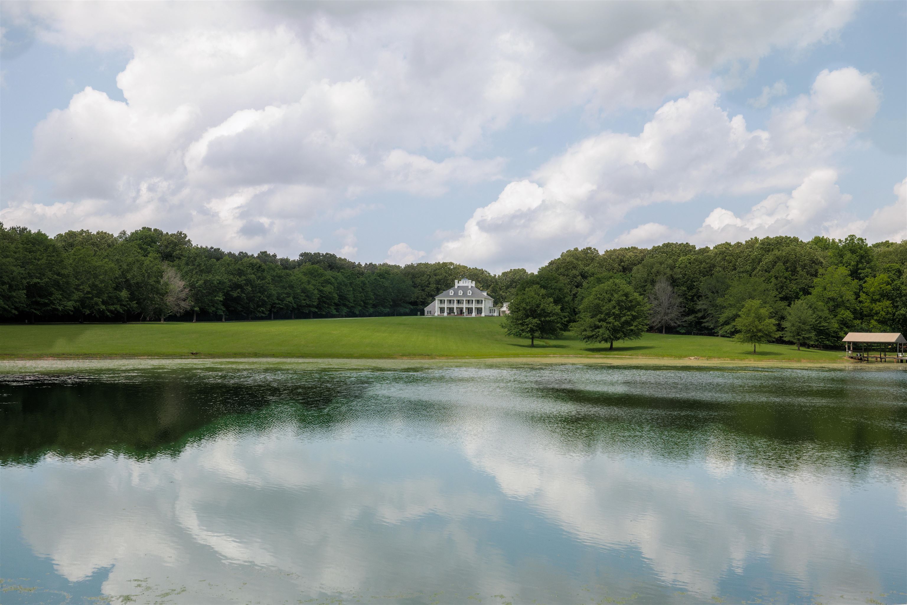 a view of a lake with a big yard