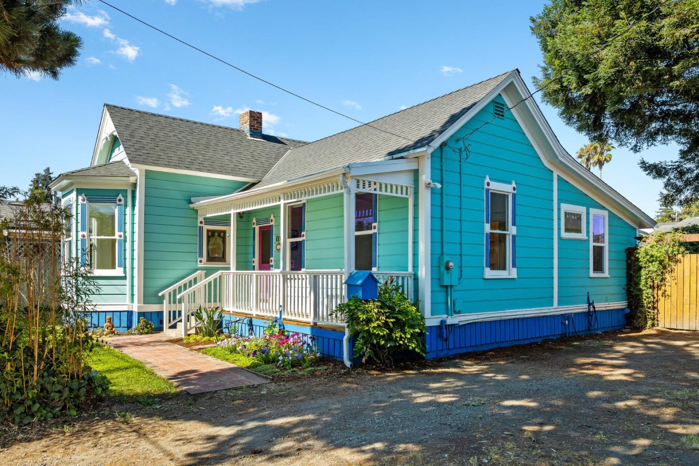 a front view of a house with garden