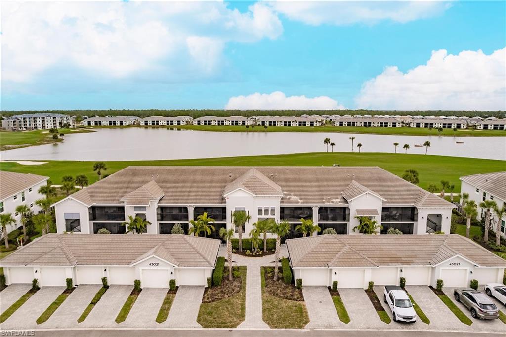 a aerial view of a house with a yard