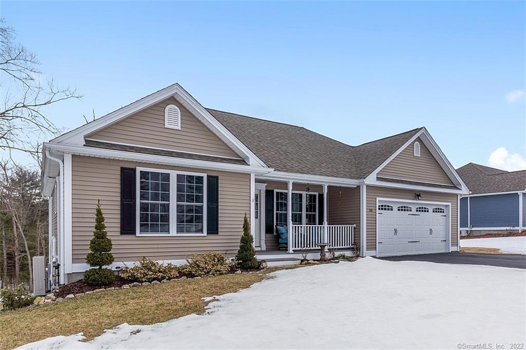 a front view of a house with a garage