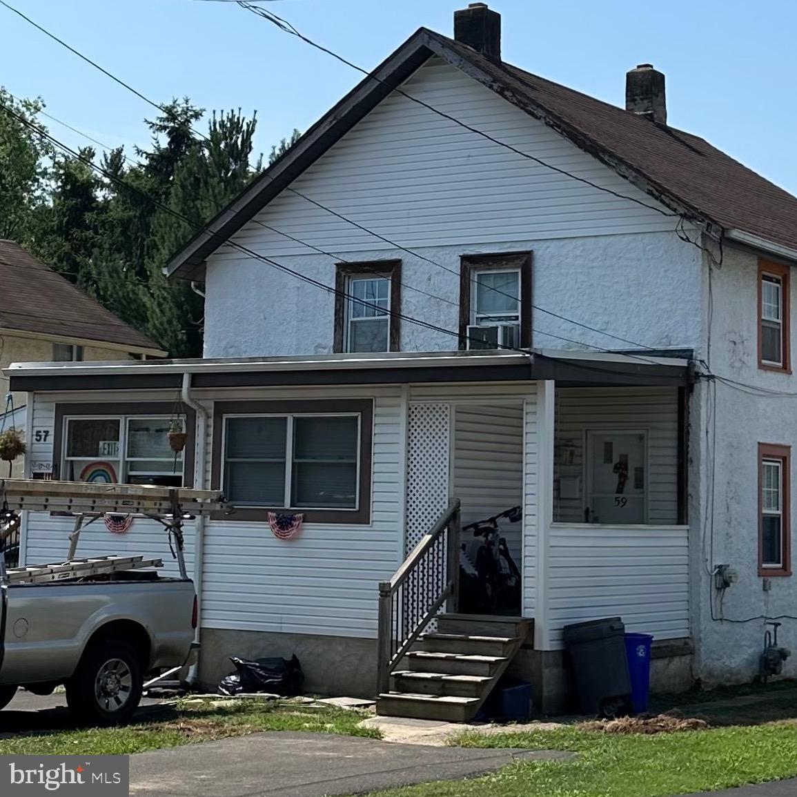 a house that has a car in front of it