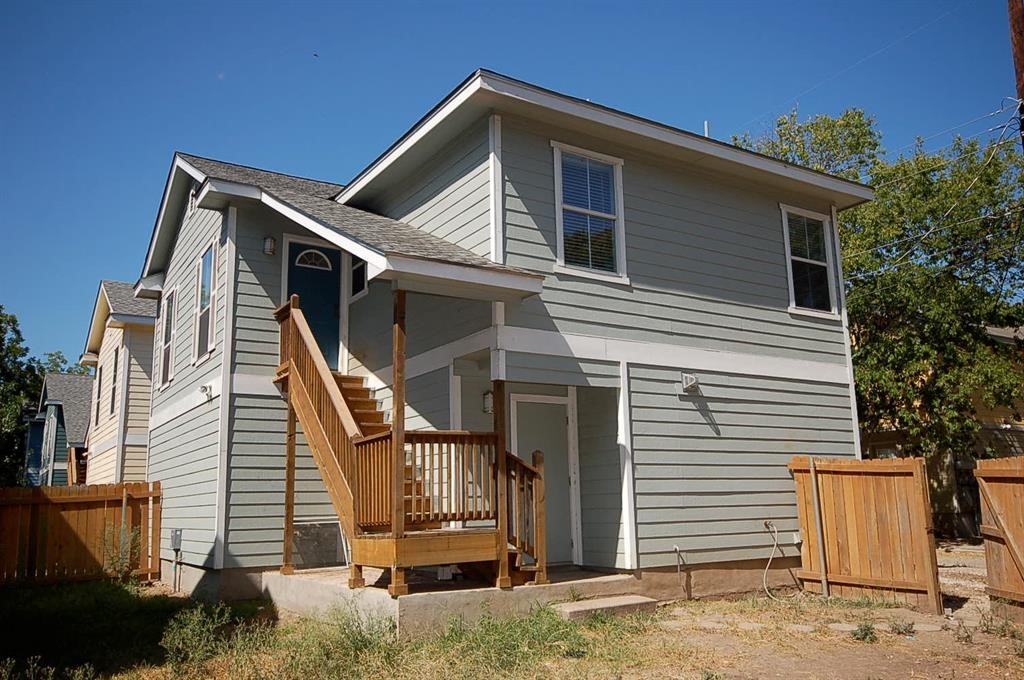 a front view of a house with garage