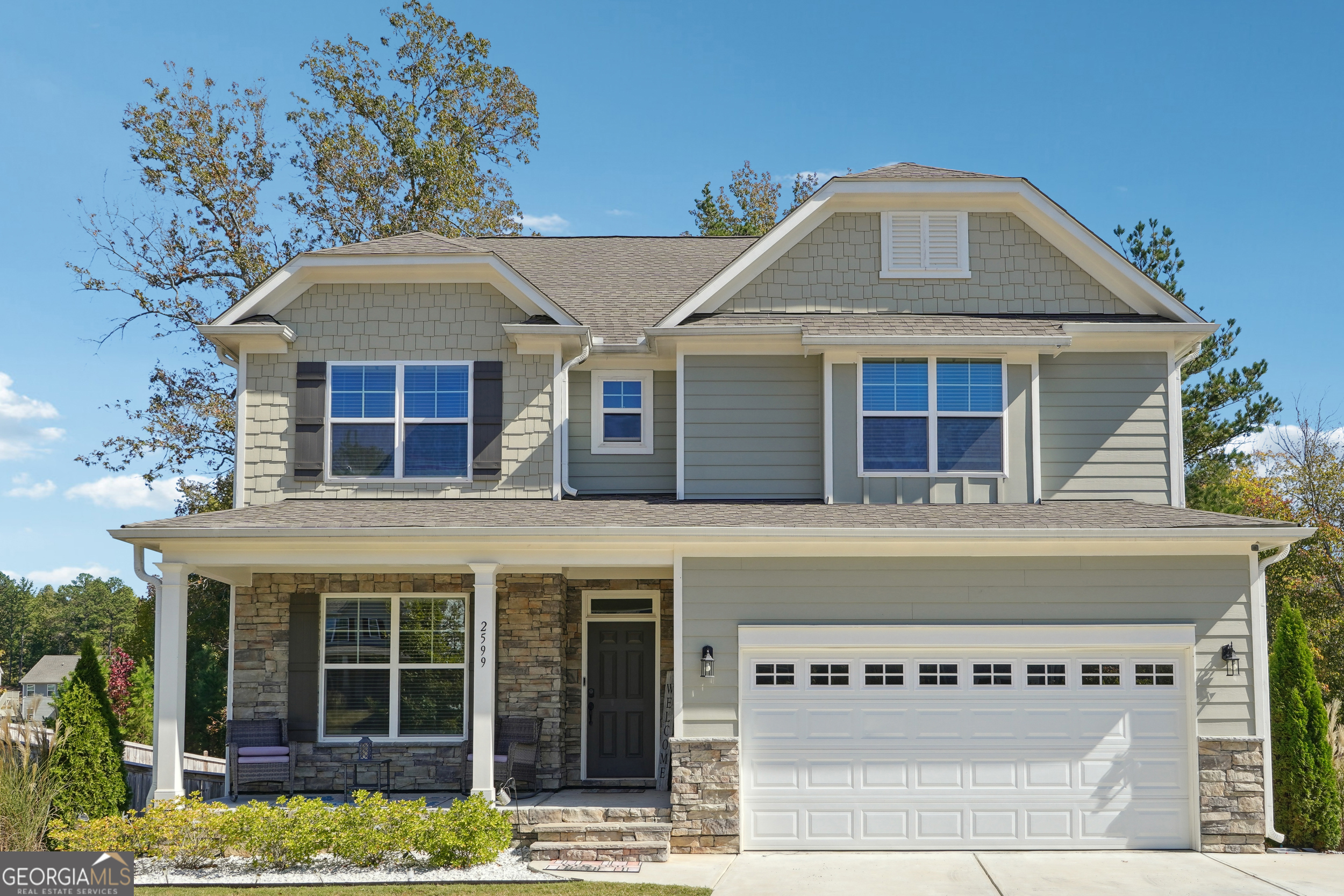 a front view of a house with a porch