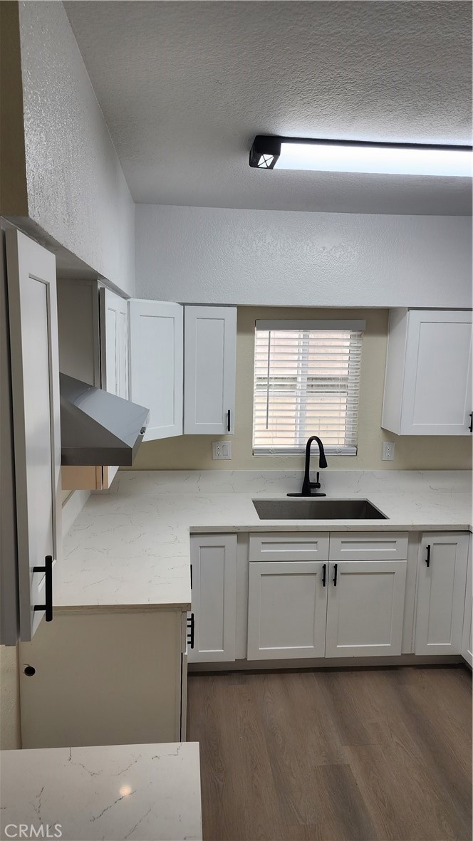 a kitchen with a sink cabinets and appliances