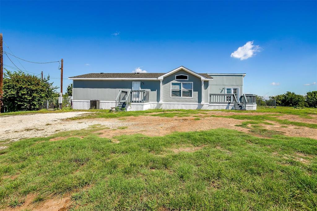 a view of a house with a big yard