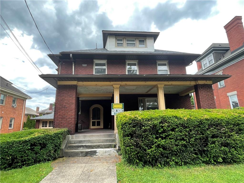 a view of a brick house with a large windows