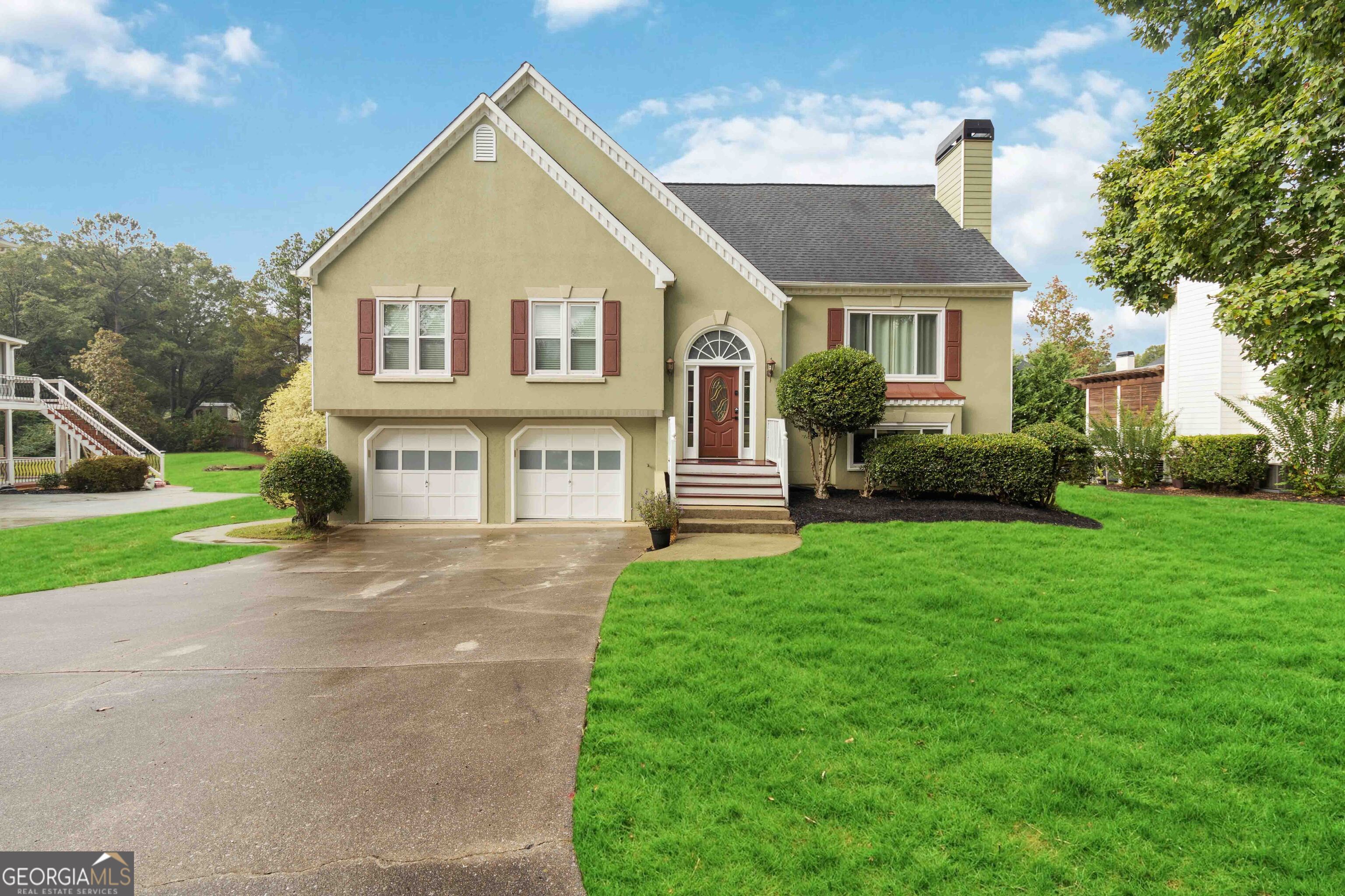 a view of house that has a yard