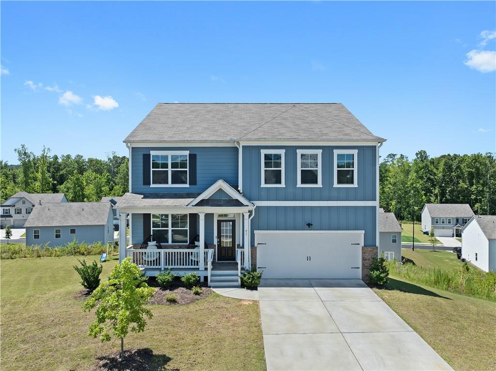 a front view of a house with a yard