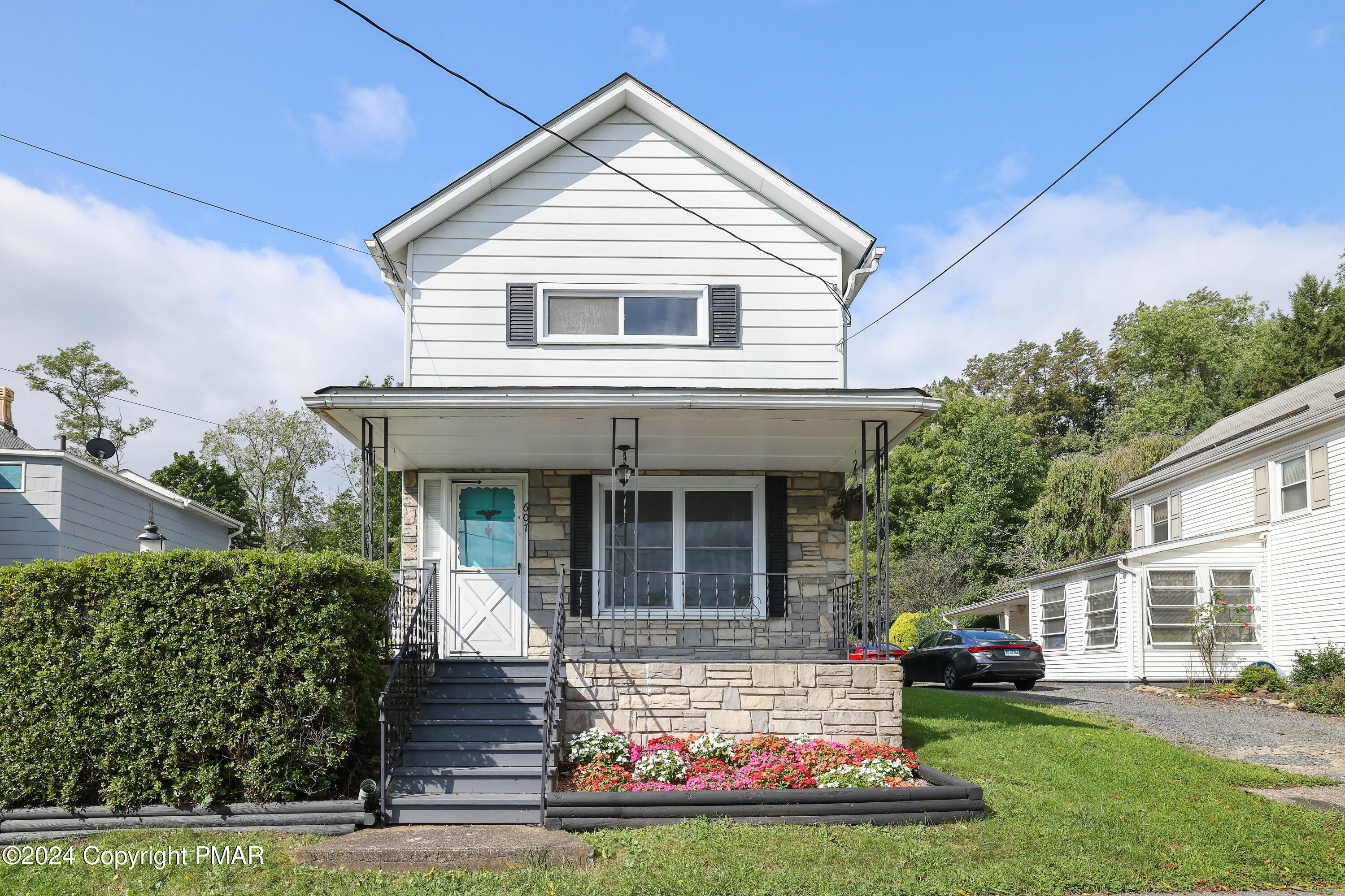 a front view of a house with garden