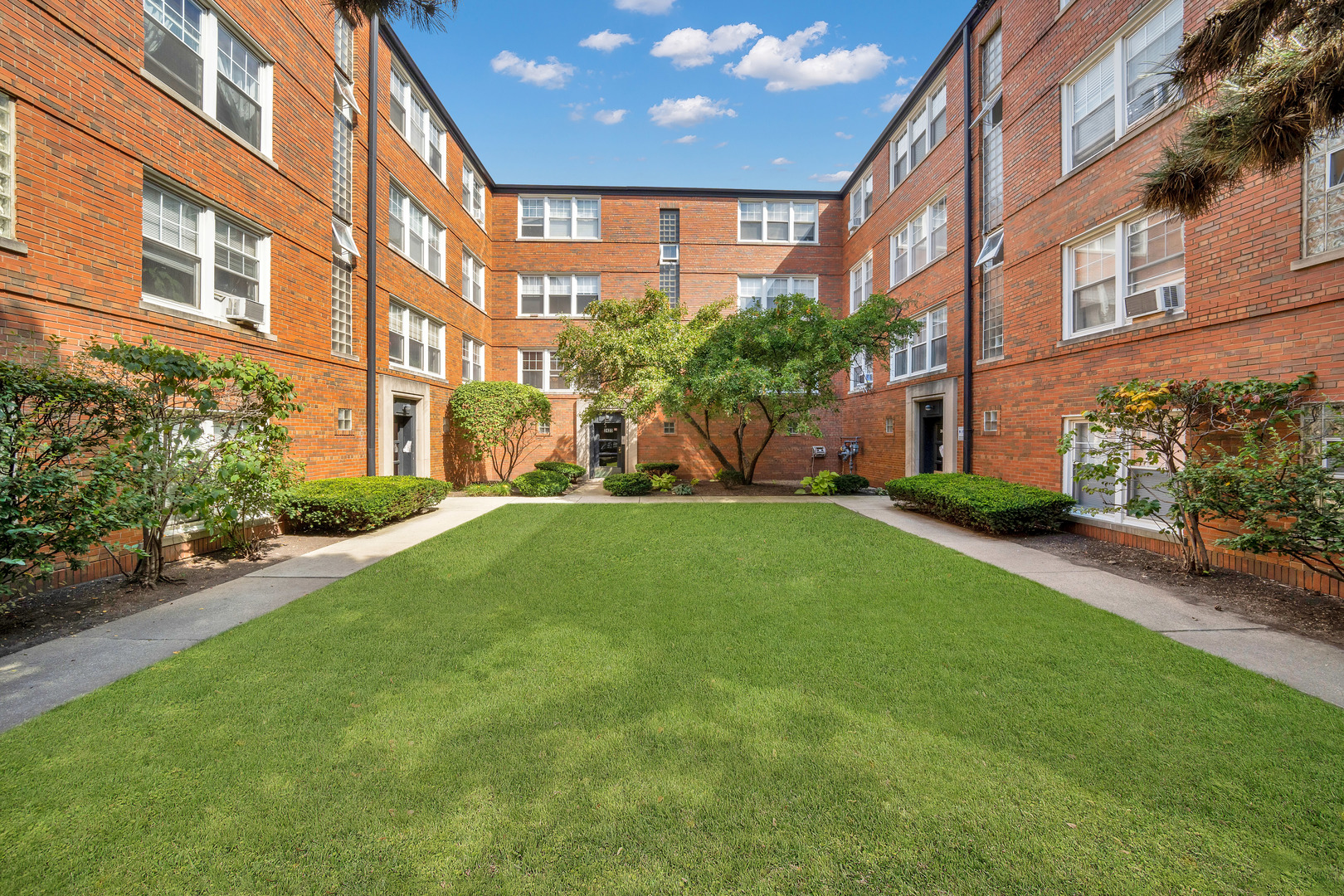 a view of a building with a yard