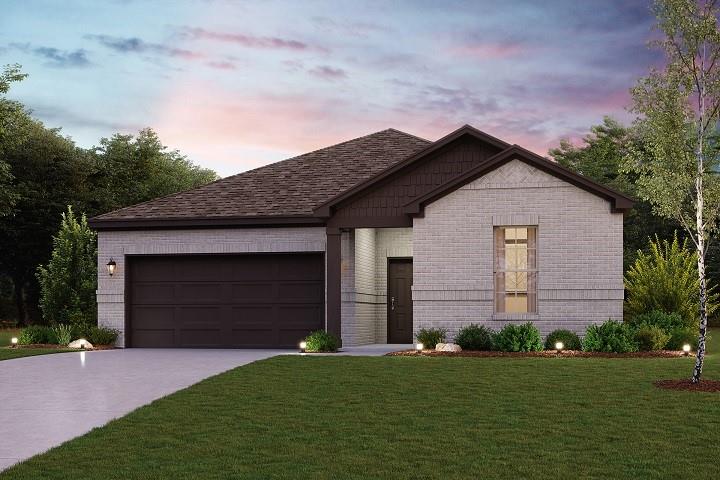 a front view of a house with a garden and garage