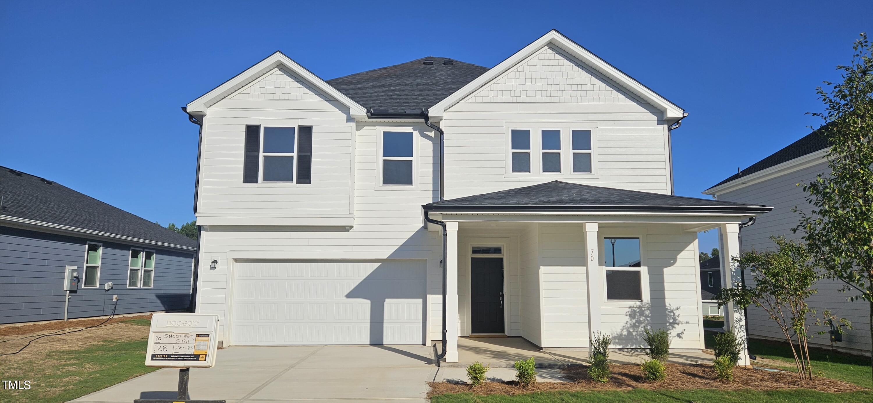 a front view of a house with garage