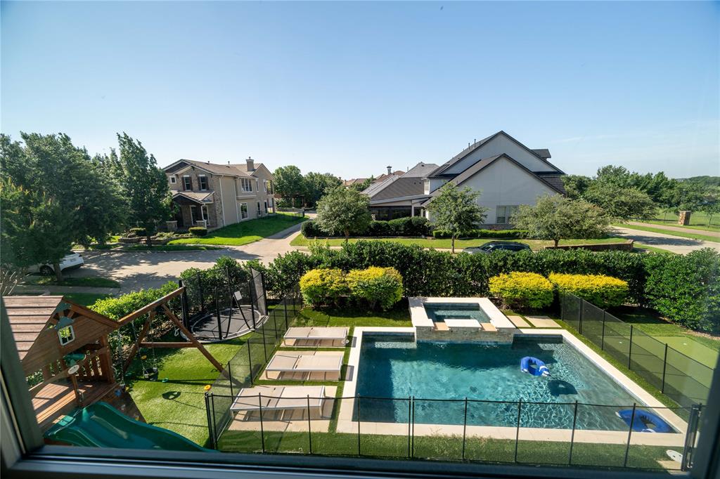 an aerial view of a house with a big yard