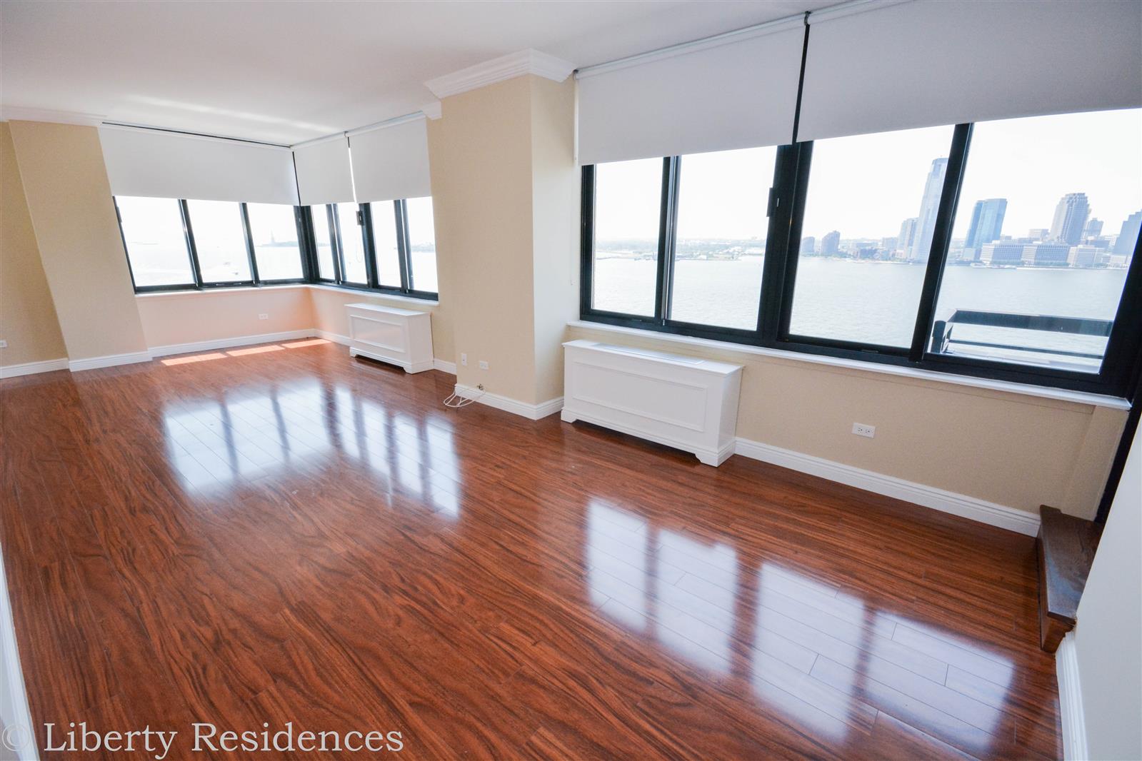 a view of an entryway with wooden floor