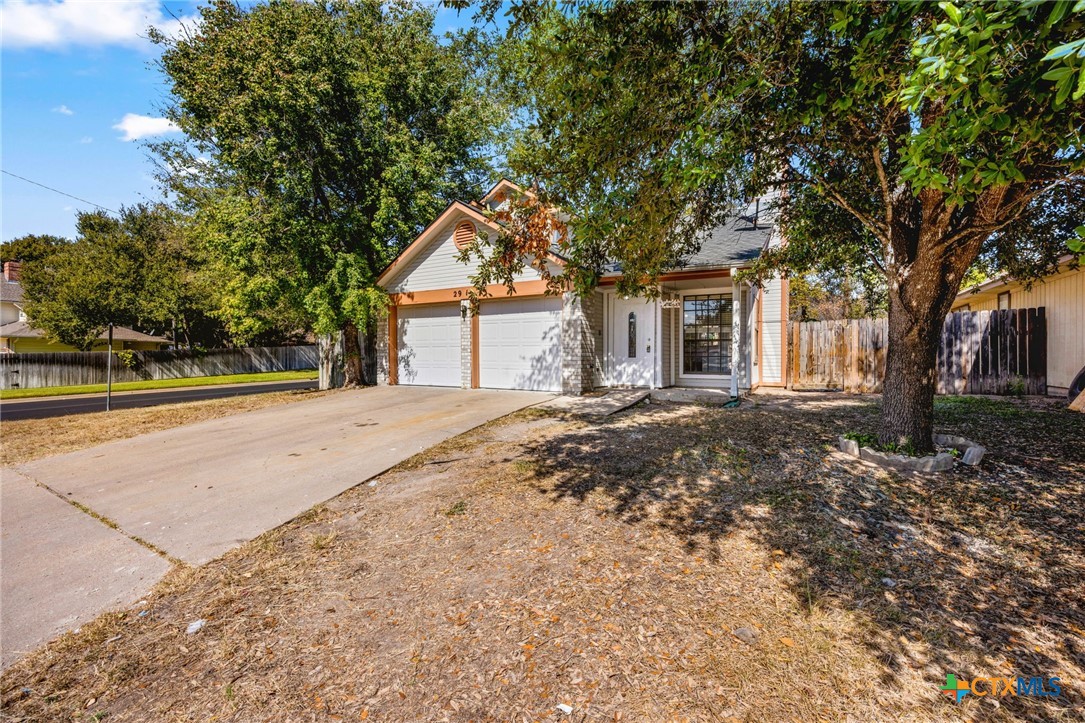 a house with trees in front of it