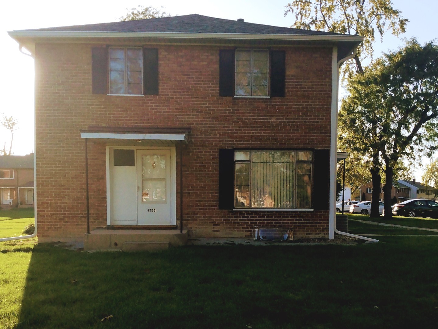 front view of a house with a yard