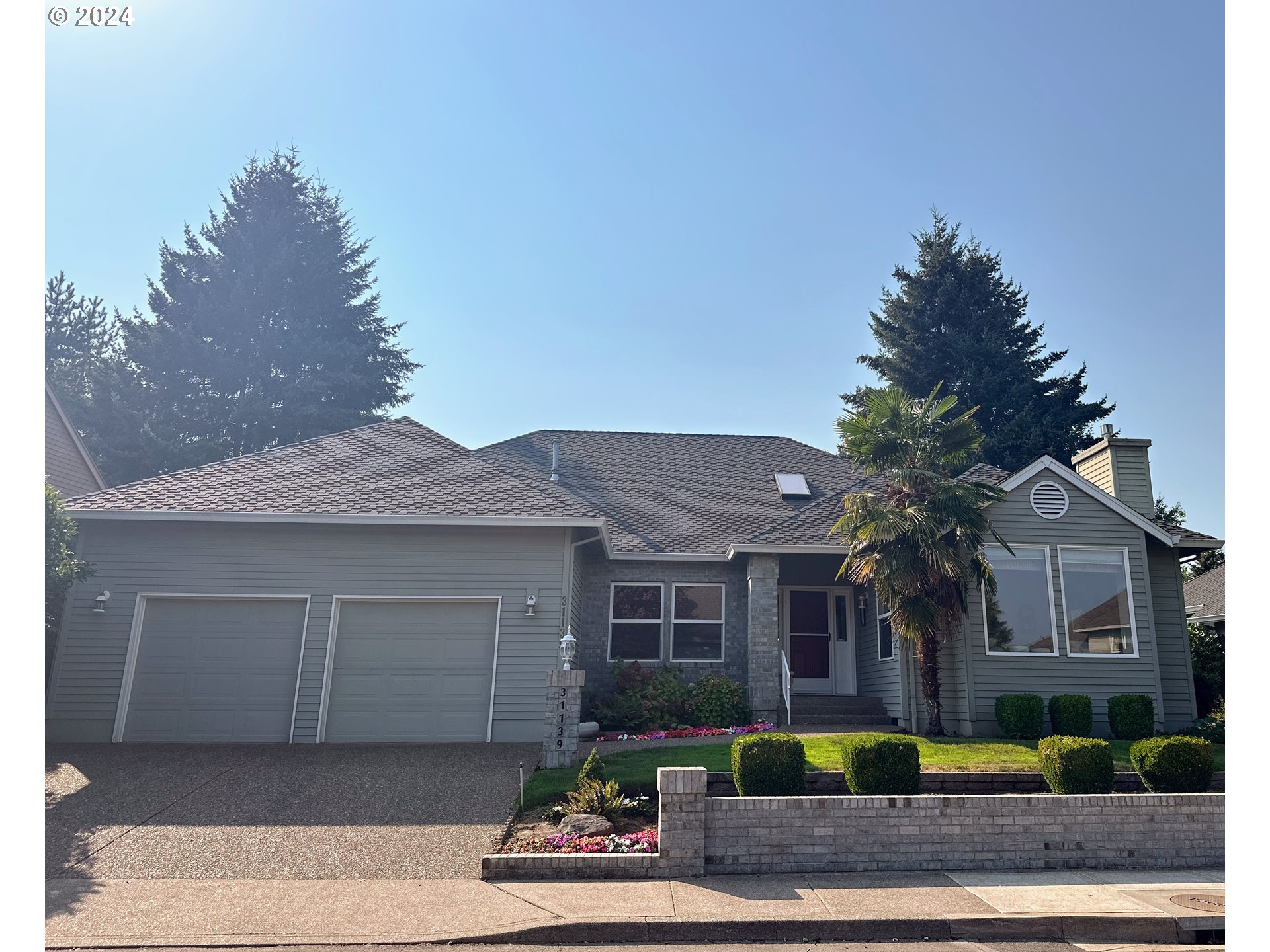 a front view of a house with garden