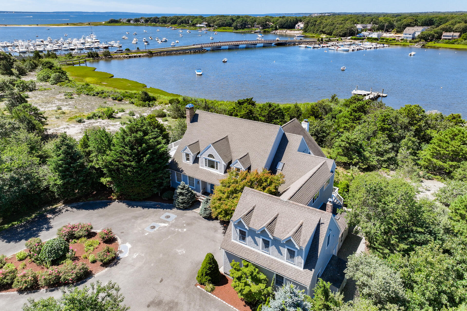 an aerial view of a house with a lake view