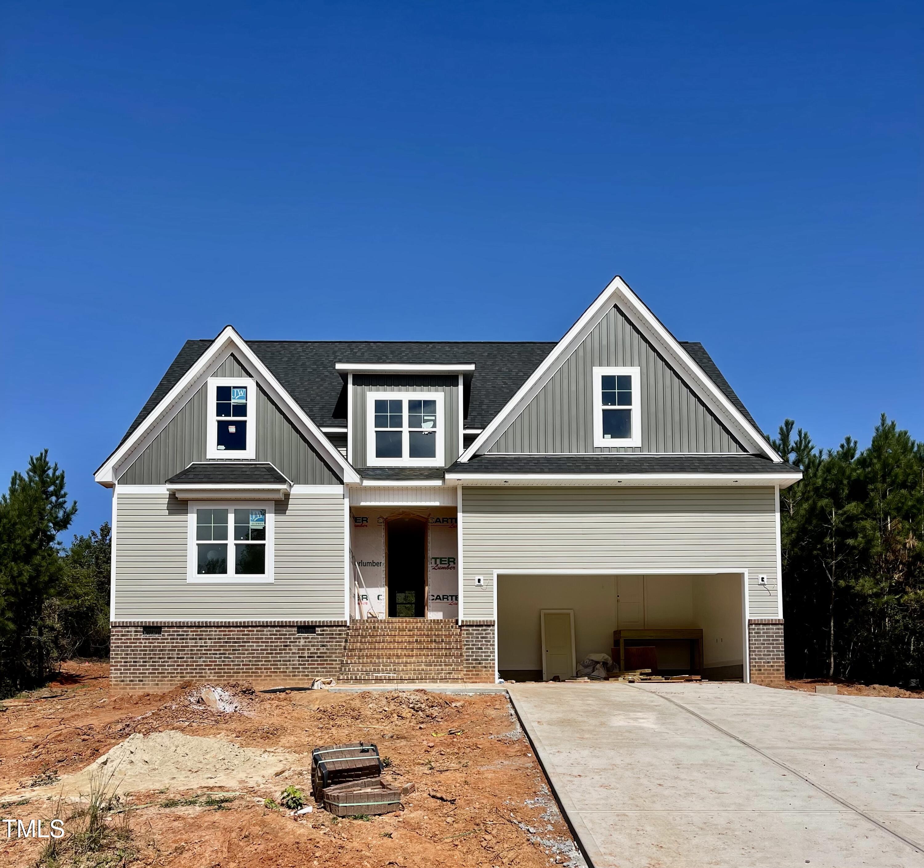 a front view of a house with yard