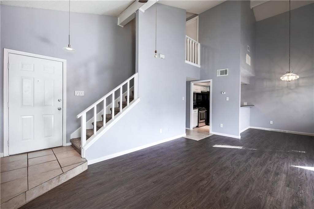 a view of an entryway with wooden floor