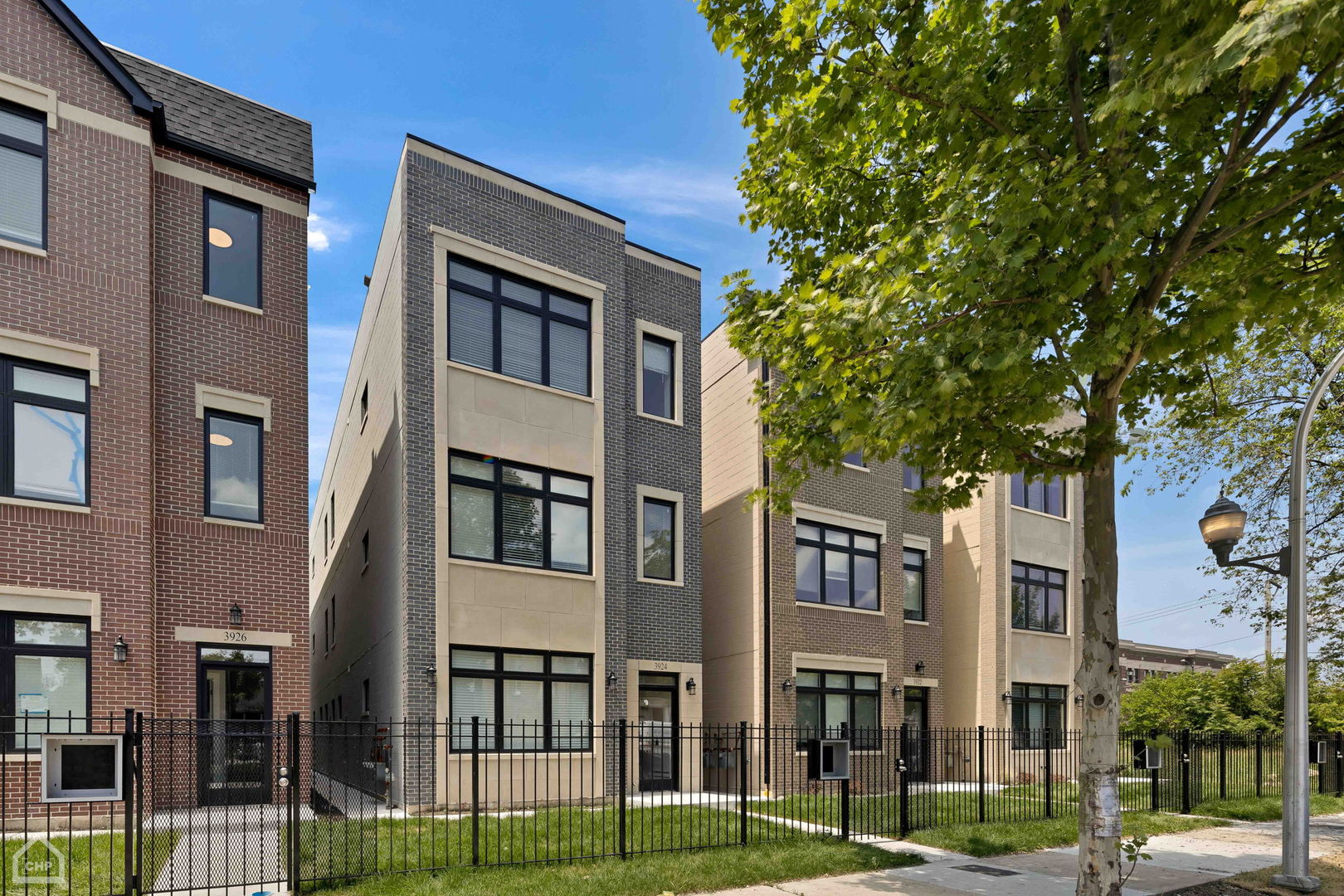 a view of a building next to a yard