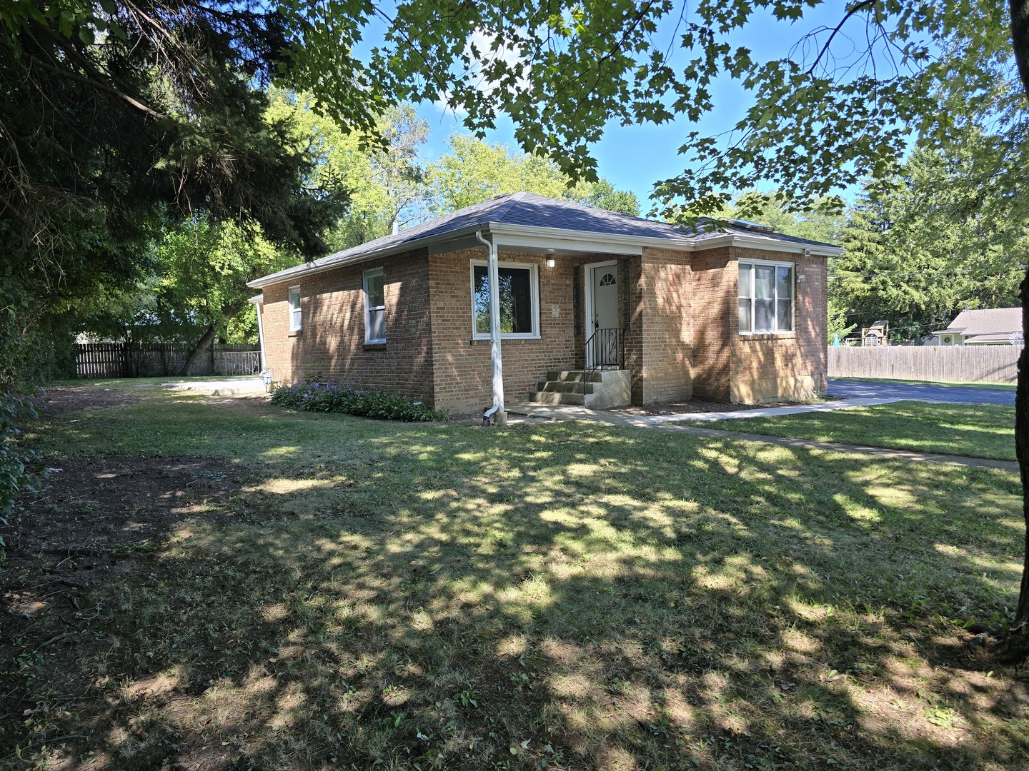 a front view of a house with yard