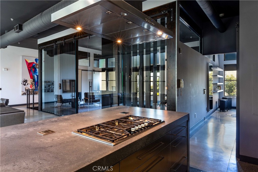 a kitchen with stainless steel appliances granite countertop a stove and a refrigerator