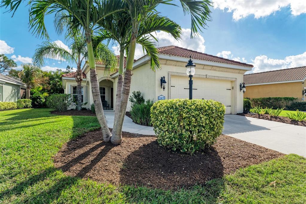 a front view of a house with garden